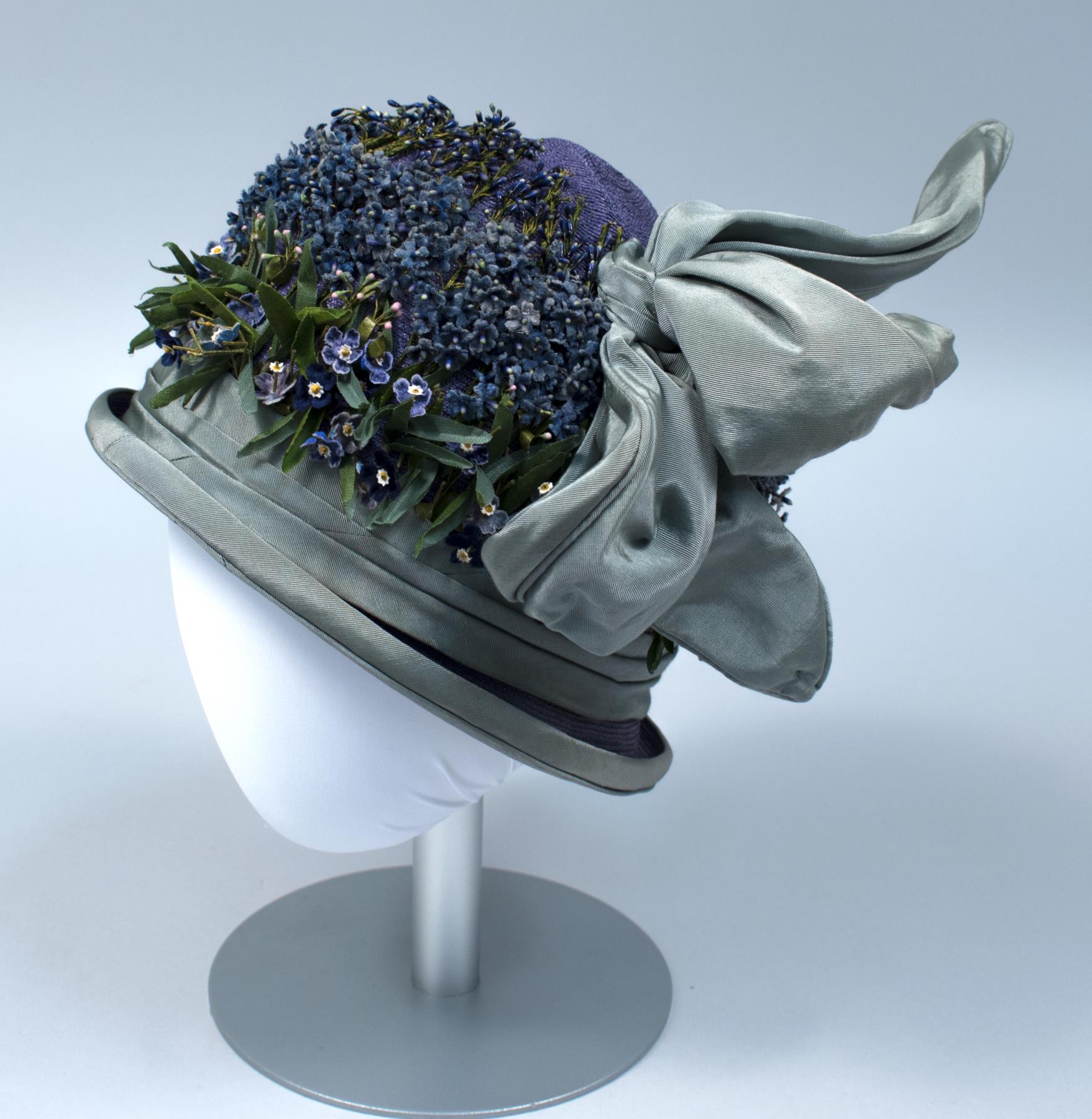 Image of Straw cloche with ribbon and fabric violet trim, 1920s